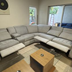 Callum Light Gray Fabric Medium 1 arm Triple Reclining Sectional 