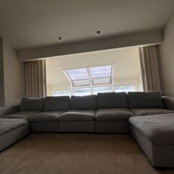 Large Light Gray Sectional Couch with Two Ottomans