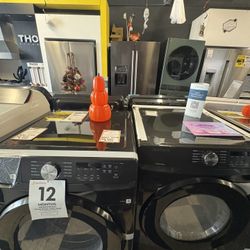 Samsung Top Load Washer and Gas Dryer In Black