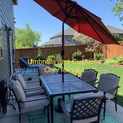 1 Outdoor Patio Umbrella And A Set Of 6 Outdoor Hampton Bay Seat Cushions. UMBRELLA STAND TABLE AND CHAIRS NOT FOR SALE 