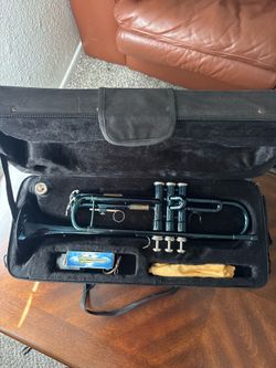 * Brand: Cecilio * Type: Bb trumpet * Finish: Black nickel (blue/black appearance) * Includes: Hard case, mouthpiece, cleaning cloth