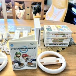 Wii Mario Kart Bundle. 2 Racing Wheels, Console, 2 Controllers,  2 NEW Nunchucks, 10  Game Lot 