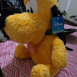 Disney Weighted Plush Pluto......Includes: 1 Disney Pluto weighted plush