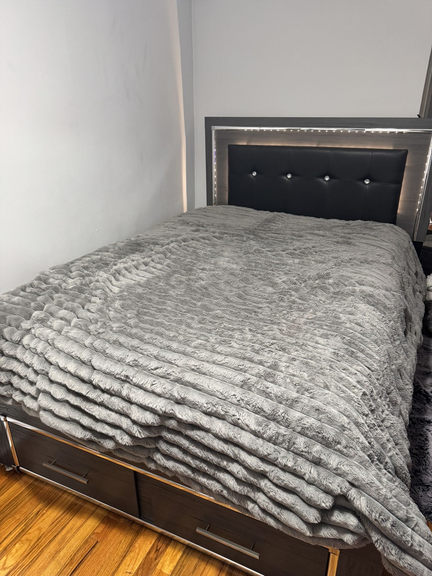 Queen-sized bed frame with storage drawers