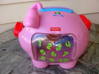 Fisher Price .. Learn Counting Pig with 7 Coins .. Singing.. Talking .. Piggy Bank by Mattel, Inc. Made in 2006 ..