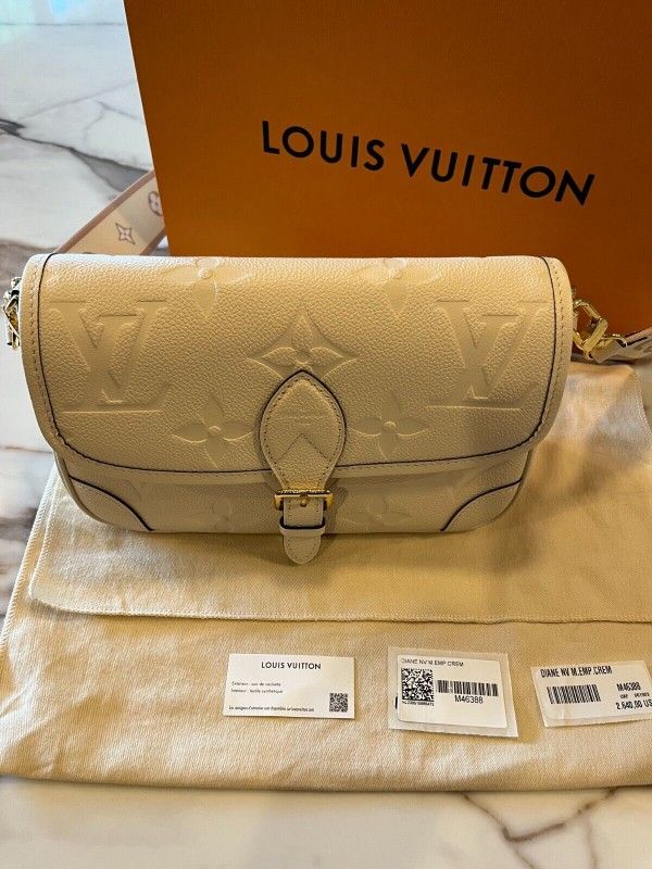 Authentic Louis Vuitton Diane Handbag in Cream Empreinte Leathe for Sale in  Philadelphia, PA - OfferUp