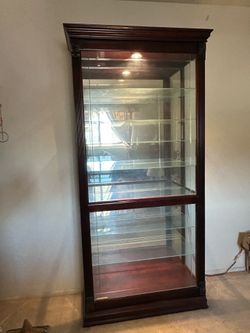 Howard Miller sliding front curio