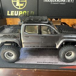 RC Element Toyota Tacoma Crawler. Comes with battery pack/remote control. Brand new Beadlock wheels and new proline tires and upgrades  Asking $350 OB