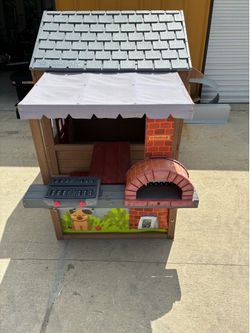 KidKraft Wooden Outdoor Playhouse with Play Kitchen, Grill & Activity Board - OBO