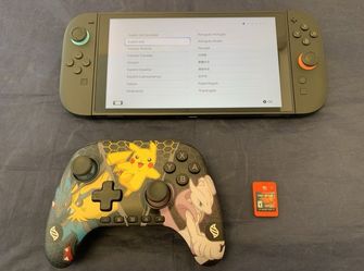 Nintendo Switch 2 Console + Joycons w/ Street Fighter 6 & Controller
