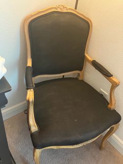 Two black arm chairs