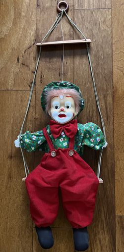 large vintage clown on swing soft bodied clown with porcelain face red hair collectible  In great condition  Approx 31 inches tall  Body of the clown  Thumbnail