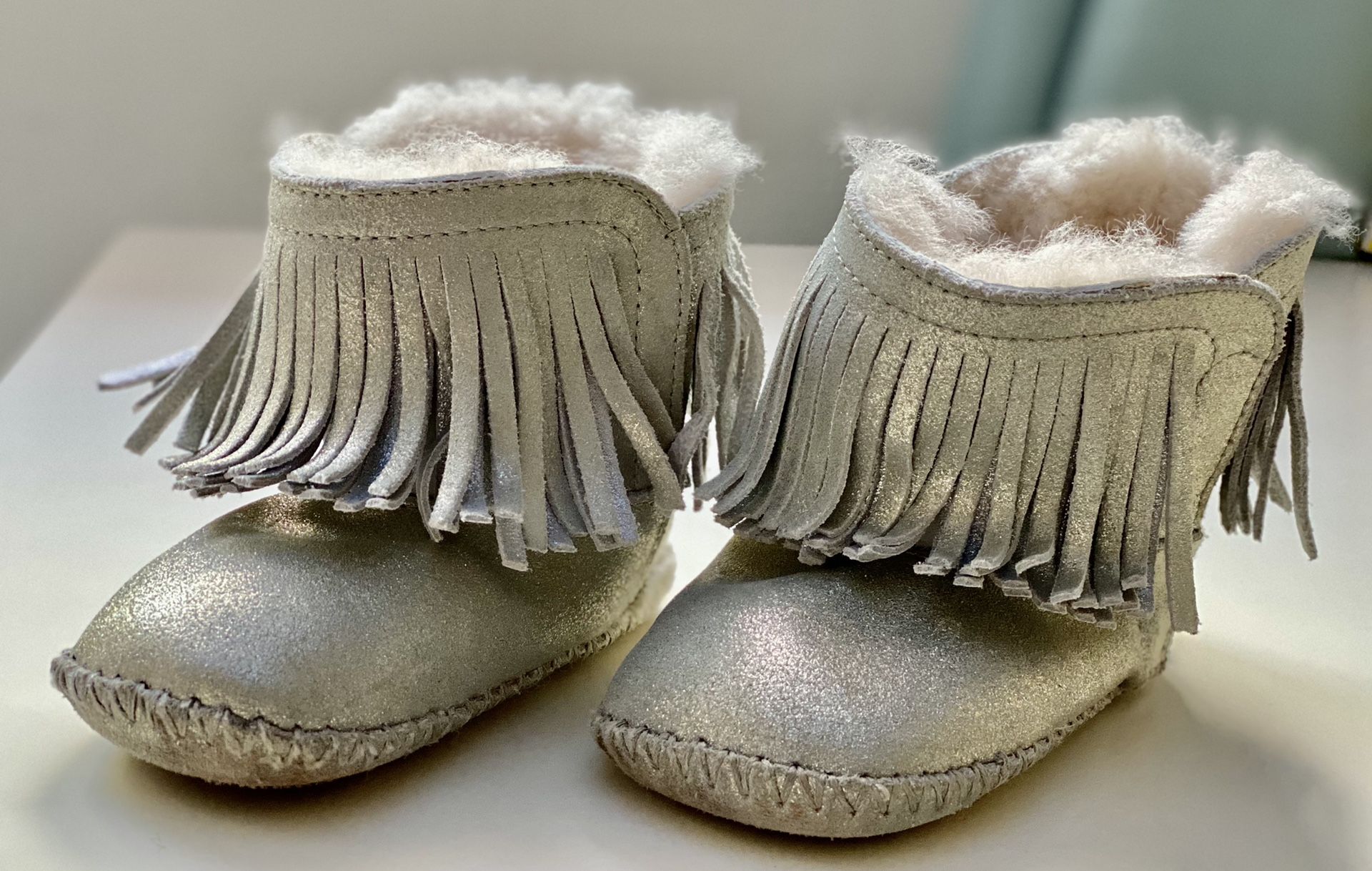 UGG cute toddler boots. Size 5. Leather upper, ship fur inside. Size