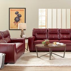 New New Leather sofa and loveseat in a rich wine color with buttonless tufted back cushions