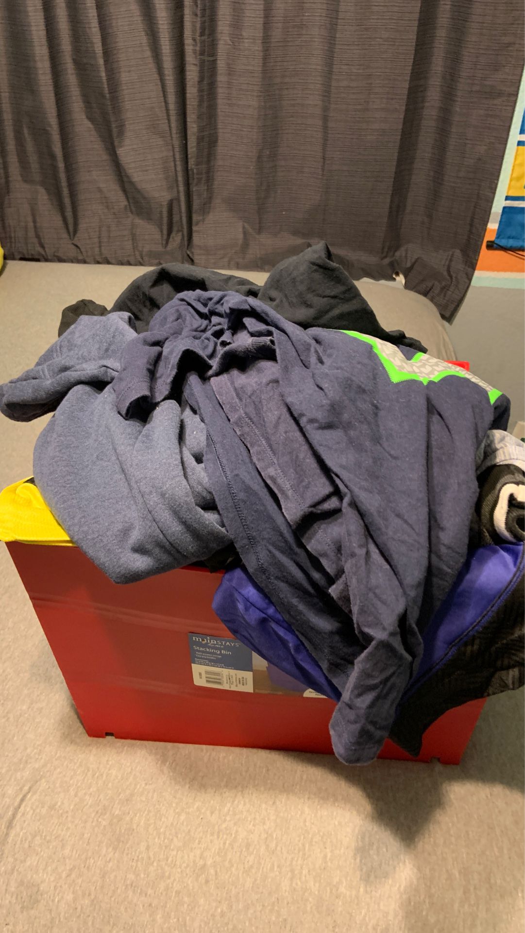 Full bin of men’s clothes large