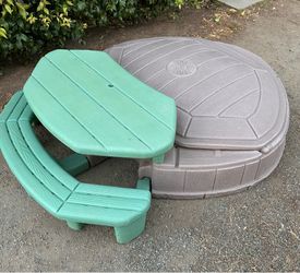 Sandbox with attached picnic table