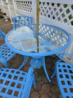 Table w/chairs , umbrella & bench. Cast Iron Aluminum durable & rust resistant.
