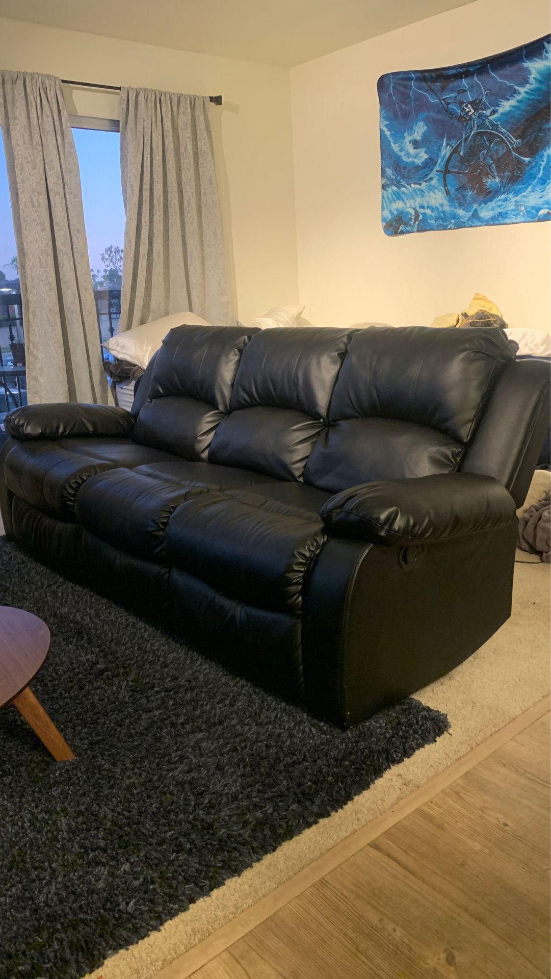Black leather reclining couch