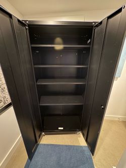 Black storage cabinet on wheels