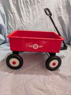 red American Girl Pleasant Company Bitty Baby wagon, featuring a prominent logo on the side.
