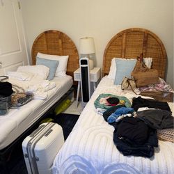 Rattan twin headboards and metal frames.