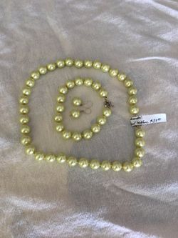 12-18 mm green shell pearl necklace complete set, necklace, earrings,and bracelet. We have other color sets and sizes and lengths.