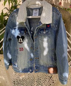 Disney Mickey Mouse denim jacket with a fleece collar.