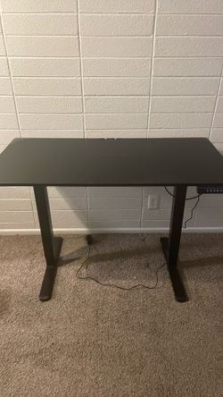 Electric raising desk