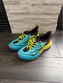 Like new Hoka Trail running Shoes - size 10.  Vibram sole