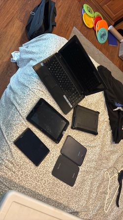 Three tablets and a laptop