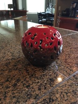 Like New 6” tall x 6” diameter tea light candle holder. Glass red/tan. Smoke free home.