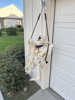 Hanging mummy on swing Halloween decoration