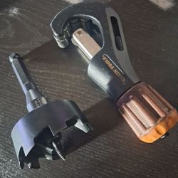 Milwaukee 2~/4 drill bit for wood  and a copper tubing cutters
