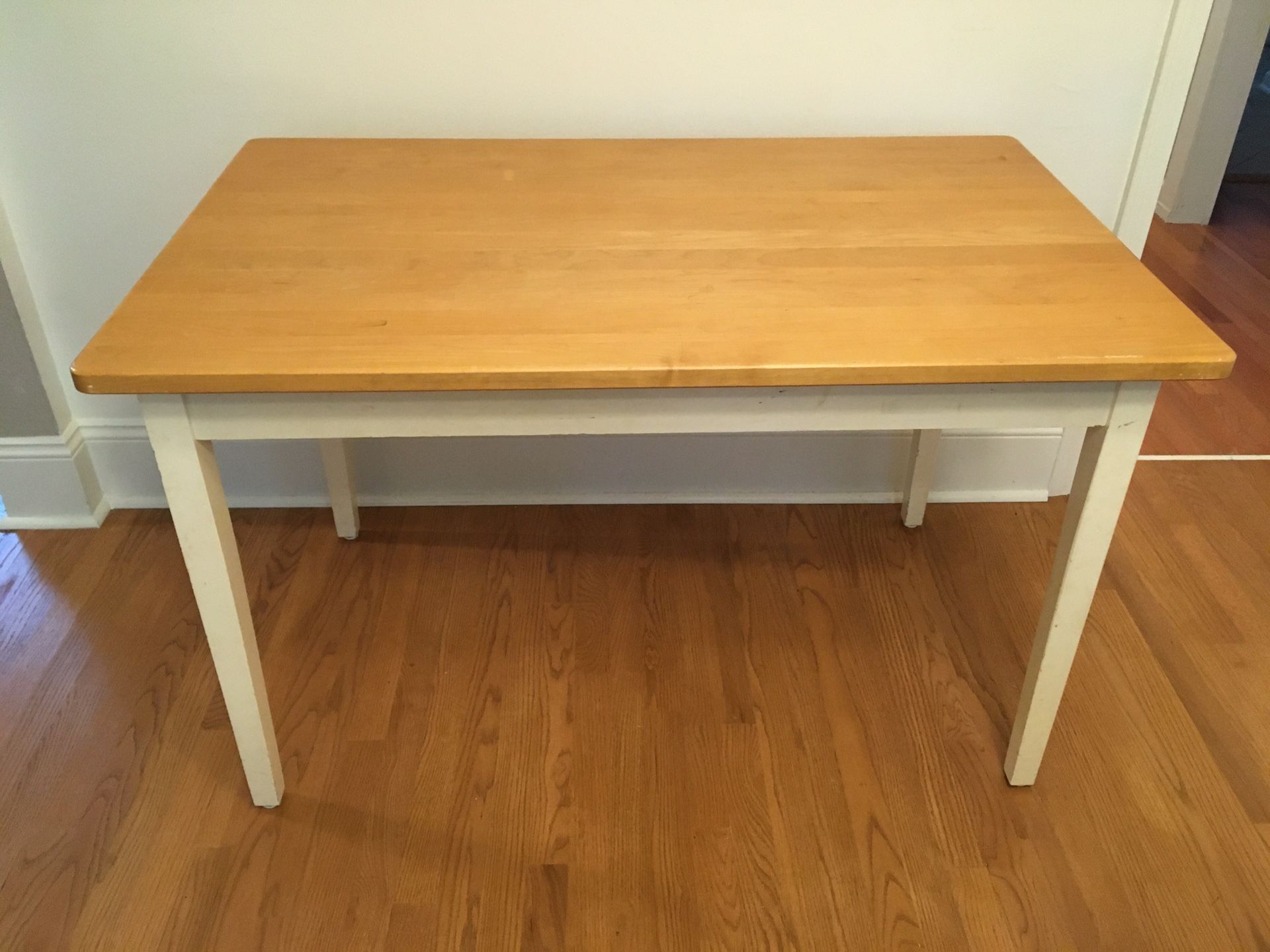 Sturdy table with wood top and white legs