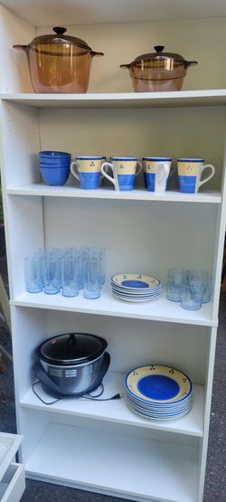 Dishes, crock pot, and stove top pots