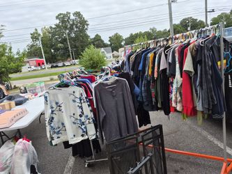 Grandma's warehouse events outside two clothes, racks of children and adults three dollars eight see descriptions