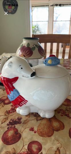 This is a ceramic polar bear cookie jar.