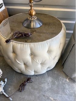 A set of 2 living room chairs, and a size  or center table.