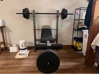 Adjustable weight bench w/ plates (100lbs)