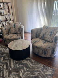 2 swivel upholstered barrel chairs and coffee table