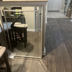 Mirror with gold trimming