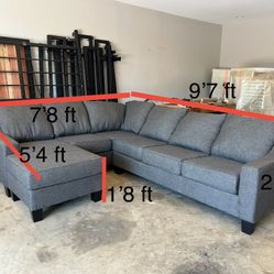 Dark grey sectional couch with reversible chaise