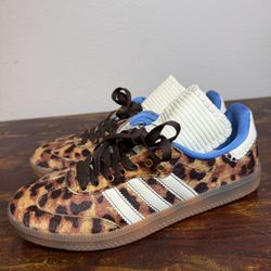 Adidas sneakers combine a bold leopard print 