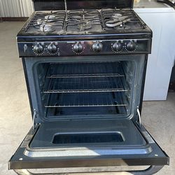 Barely used GE gas range needs a home.