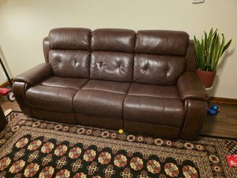 Brown leather couch and loveseat set