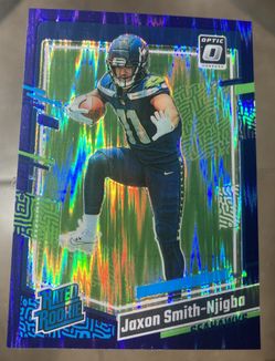  2023 Donruss Optic Rated Rookies#293 Jaxon Smith-Njigba Purple Shock RC Card NFL. Beautiful card ready to be graded