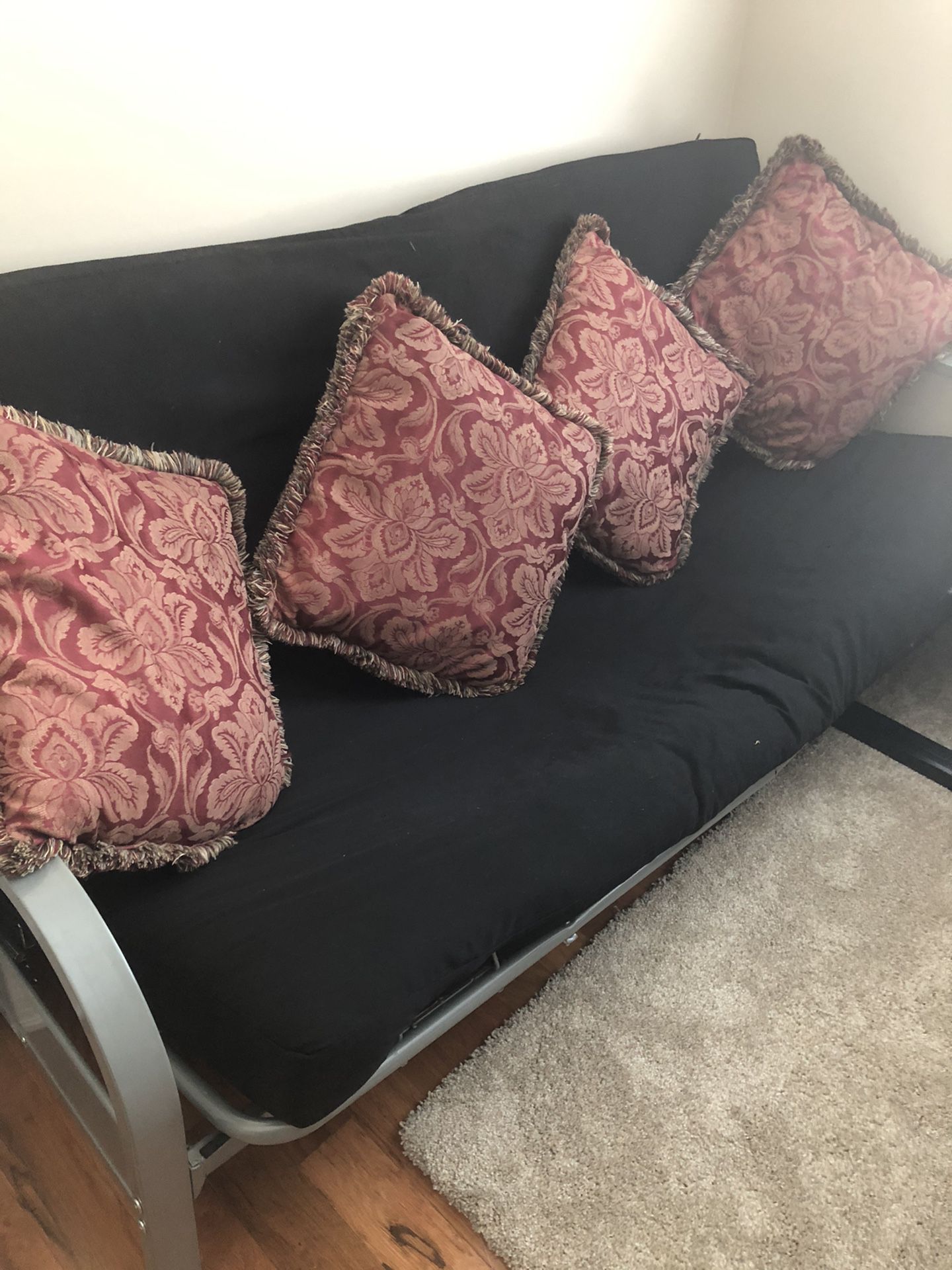 Futon with mattress and four pillows