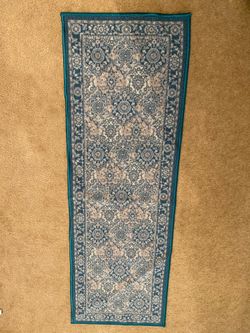 Blue-green and gray carpet runner