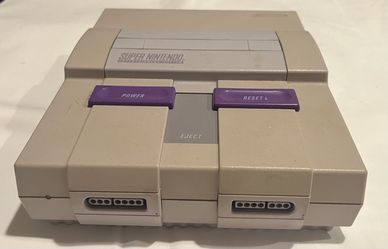 Super Nintendo Entertainment System (SNES) console, controllers, manual