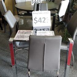 Brand New Glass Dining Table (48×30×30H) + Four Gray Or Black Leather Chairs